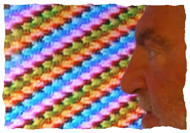 Image of Steve Beck in profile with weaving in the background